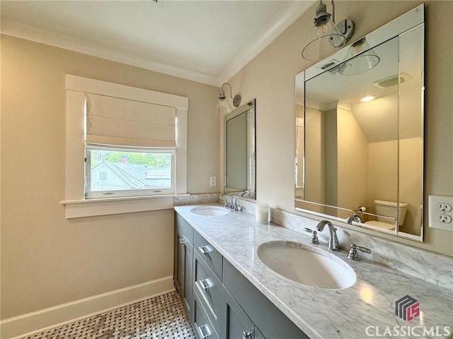 125 Woodland Way, Athens, GA 30606 - bathroom with toilet, double vanity, baseboards, and crown molding