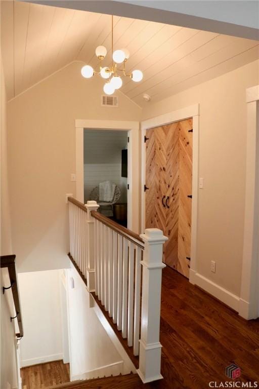 125 Woodland Way, Athens, GA 30606 - stairs with wood finished floors, a chandelier, vaulted ceiling, and baseboards