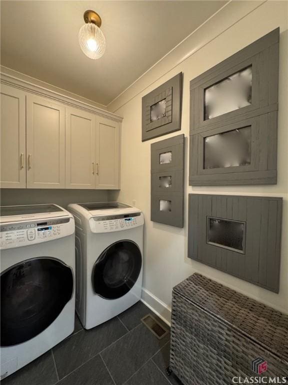 125 Woodland Way, Athens, GA 30606 - laundry area featuring cabinet space, washing machine and clothes dryer, dark tile patterned flooring, baseboards, and ornamental molding