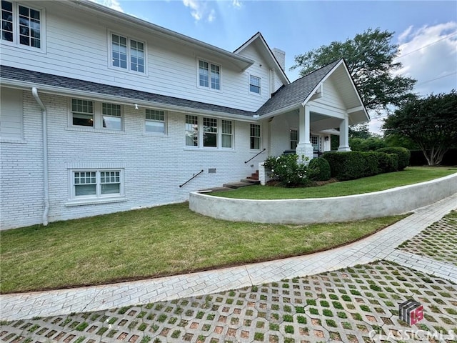 125 Woodland Way, Athens, GA 30606 - view of home's exterior featuring a yard, brick siding, and a chimney