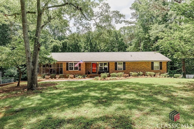 226 Baker St, Statham, GA 30666 - ranch-style home featuring brick siding and a front yard