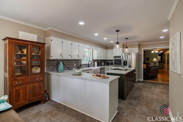 226 Baker St, Statham, GA 30666 - kitchen featuring appliances with stainless steel finishes, crown molding, light countertops, decorative backsplash, and a ceiling fan