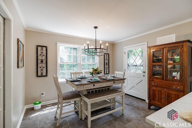 226 Baker St, Statham, GA 30666 - dining room with a chandelier, healthy amount of natural light, ornamental molding, and stone finish flooring