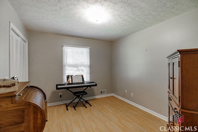 226 Baker St, Statham, GA 30666 - office space featuring light wood-type flooring and a textured ceiling
