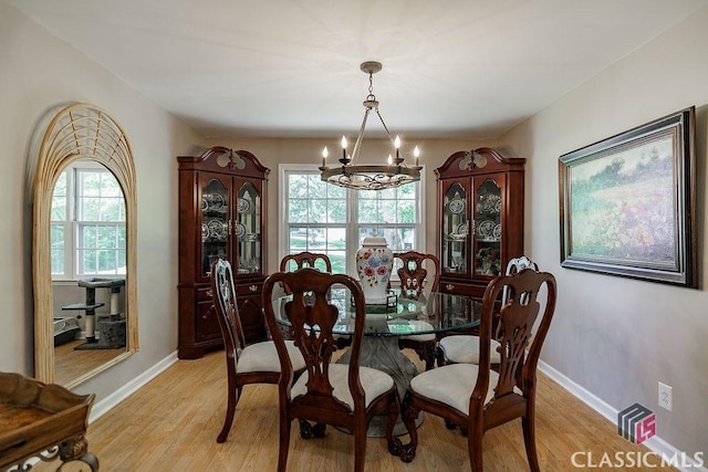 226 Baker St, Statham, GA 30666 - dining area with a chandelier and light wood finished floors