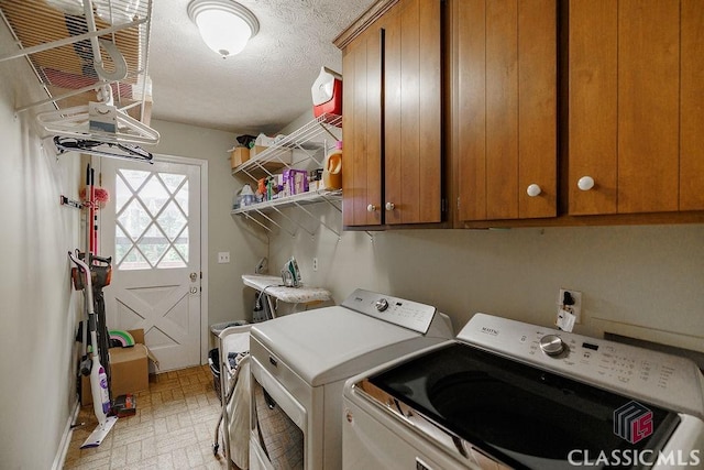 226 Baker St, Statham, GA 30666 - laundry area featuring washer and clothes dryer, cabinet space, brick patterned flooring, and a textured ceiling