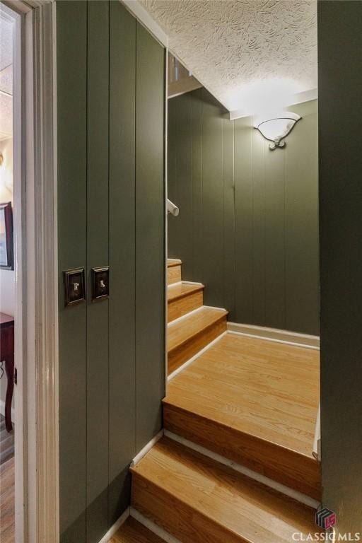 226 Baker St, Statham, GA 30666 - stairs featuring wood finished floors and a textured ceiling
