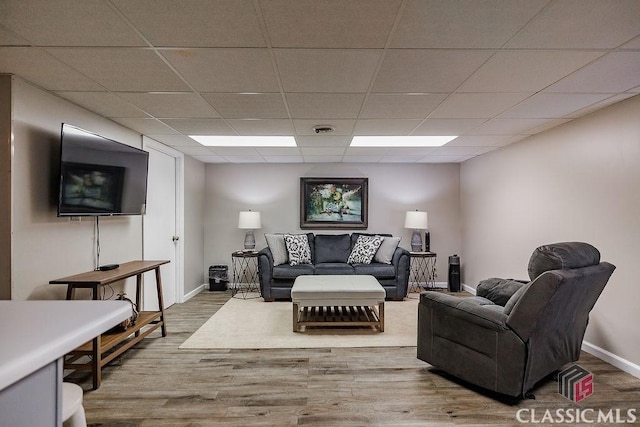 226 Baker St, Statham, GA 30666 - living room featuring a paneled ceiling and wood finished floors