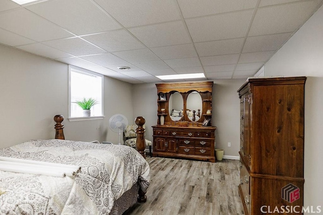 226 Baker St, Statham, GA 30666 - bedroom featuring light wood-type flooring and a paneled ceiling