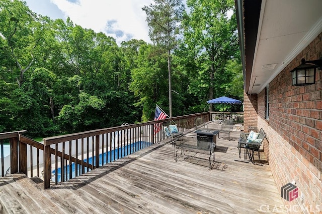 226 Baker St, Statham, GA 30666 - wooden deck with outdoor dining space