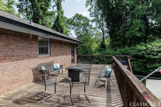 226 Baker St, Statham, GA 30666 - wooden terrace featuring an outdoor fire pit