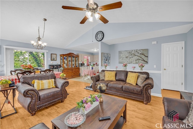5480 Apache Trl, Gainesville, GA 30506 - living room featuring vaulted ceiling, a chandelier, light wood finished floors, and ceiling fan
