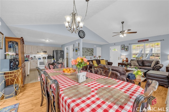 5480 Apache Trl, Gainesville, GA 30506 - dining room with vaulted ceiling, light wood-style flooring, ceiling fan, and a chandelier