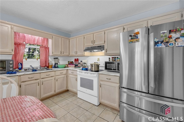5480 Apache Trl, Gainesville, GA 30506 - kitchen featuring appliances with stainless steel finishes, under cabinet range hood, light countertops, decorative backsplash, and a textured ceiling