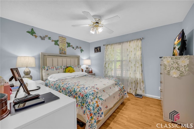 5480 Apache Trl, Gainesville, GA 30506 - bedroom featuring light wood-type flooring and a ceiling fan