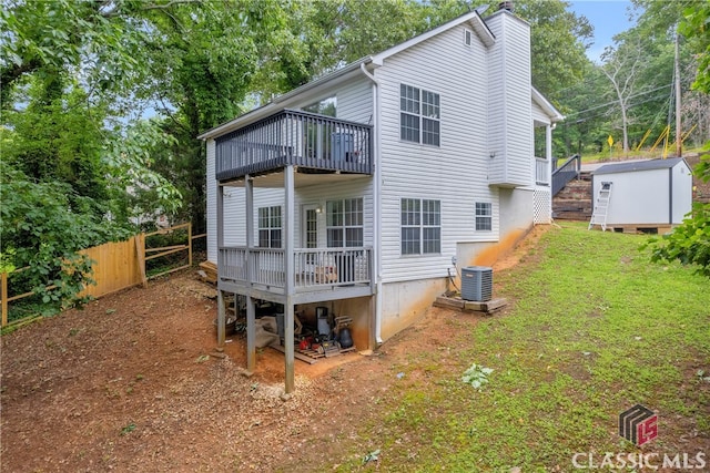 5480 Apache Trl, Gainesville, GA 30506 - rear view of house featuring a shed, a chimney, a wooden deck, and a balcony