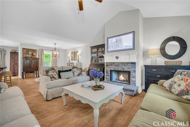 120 Peach Ln, Royston, GA 30662 - living area featuring a ceiling fan, light wood finished floors, a stone fireplace, and high vaulted ceiling