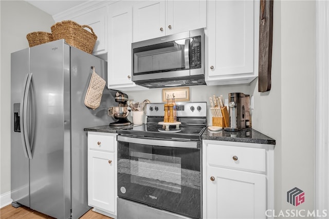 120 Peach Ln, Royston, GA 30662 - kitchen featuring stainless steel appliances, white cabinetry, dark stone countertops, and light wood-type flooring