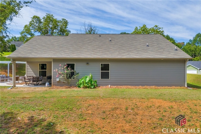 120 Peach Ln, Royston, GA 30662 - rear view of house with a patio, a yard, and a shingled roof