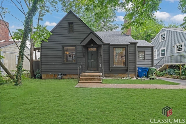 1042 Faith Ave, Atlanta, GA 30316 - view of front of home featuring a chimney, a front lawn, and roof with shingles