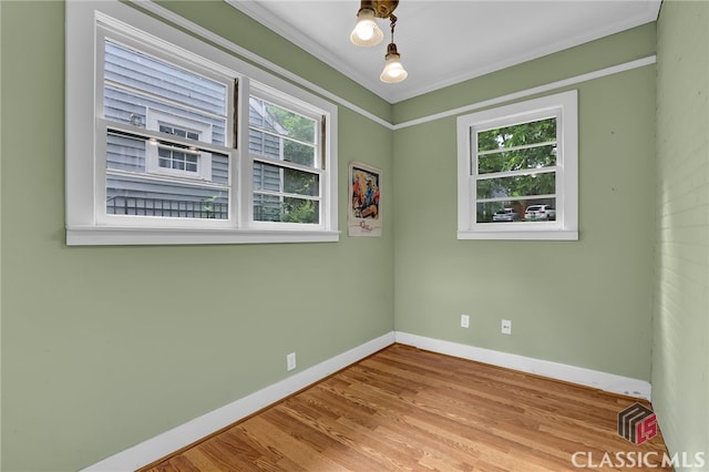 1042 Faith Ave, Atlanta, GA 30316 - spare room featuring wood finished floors and crown molding