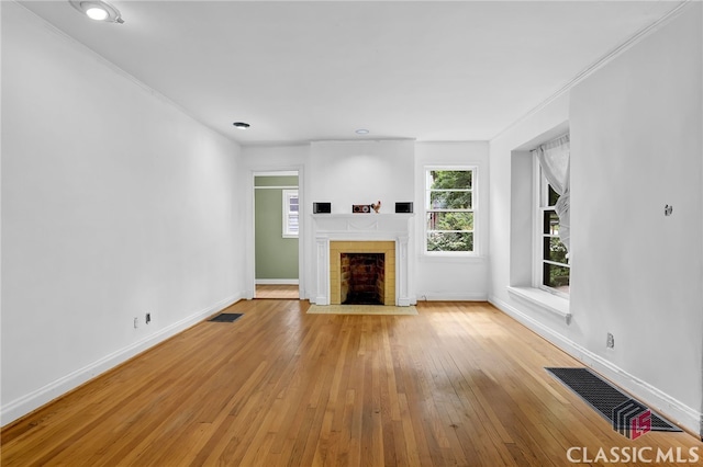 1042 Faith Ave, Atlanta, GA 30316 - unfurnished living room with a fireplace with flush hearth and hardwood / wood-style flooring