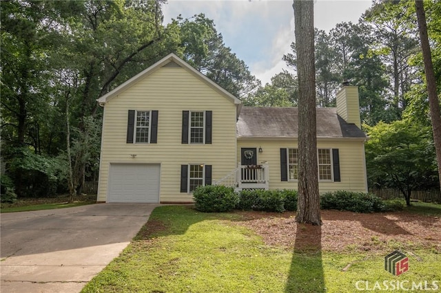 170 Chadds Walk, Athens, GA 30606 - tri-level home featuring an attached garage, a chimney, concrete driveway, and a front lawn