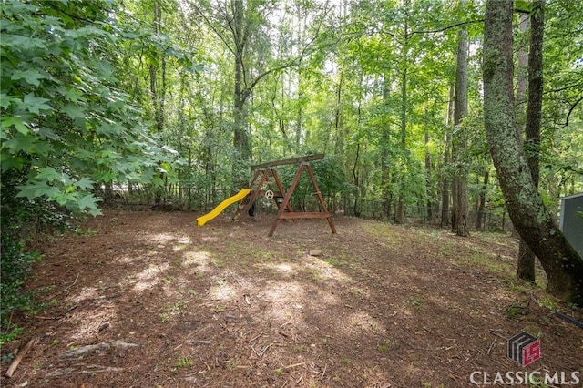 170 Chadds Walk, Athens, GA 30606 - fenced backyard featuring a playground and a forest view