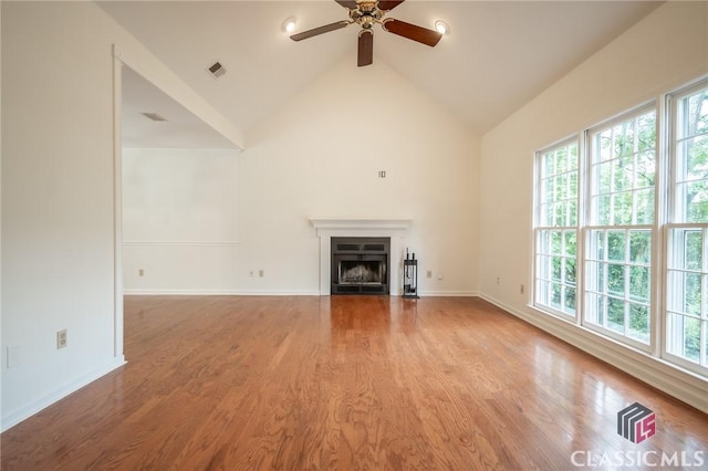 170 Chadds Walk, Athens, GA 30606 - unfurnished living room featuring a ceiling fan, wood finished floors, a fireplace with flush hearth, and high vaulted ceiling