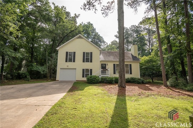 170 Chadds Walk, Athens, GA 30606 - split level home with a chimney, driveway, a garage, and a front lawn