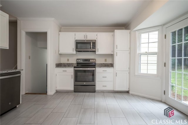 170 Chadds Walk, Athens, GA 30606 - kitchen with appliances with stainless steel finishes, plenty of natural light, light stone counters, white cabinets, and crown molding