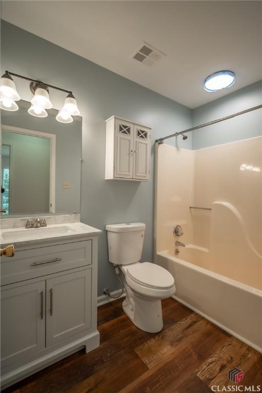 170 Chadds Walk, Athens, GA 30606 - full bathroom featuring wood finished floors, vanity, and washtub / shower combination