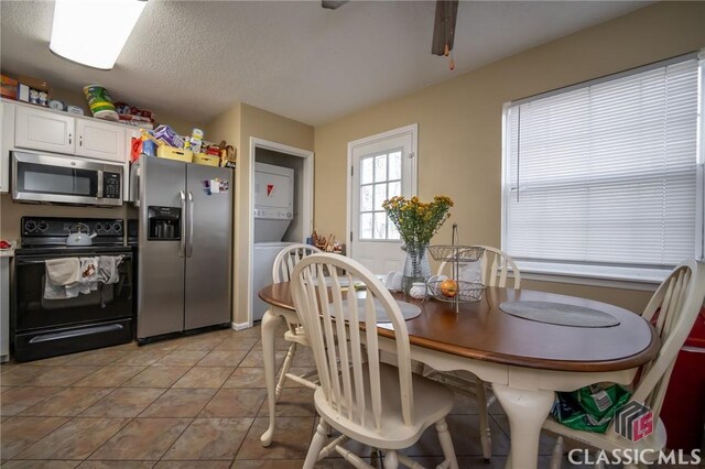 2165 S Milledge Ave Unit F4, Athens, GA 30605 - dining space featuring light tile patterned floors and a textured ceiling