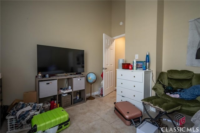 2165 S Milledge Ave Unit F4, Athens, GA 30605 - bedroom featuring light tile patterned flooring and a high ceiling