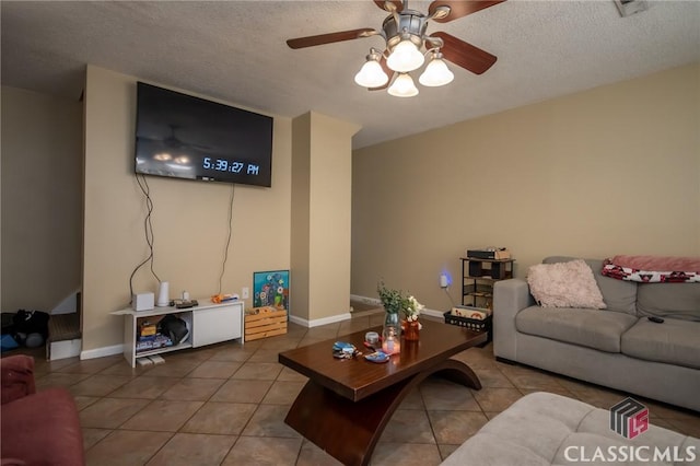 2165 S Milledge Ave Unit F4, Athens, GA 30605 - living area with tile patterned floors, ceiling fan, and a textured ceiling