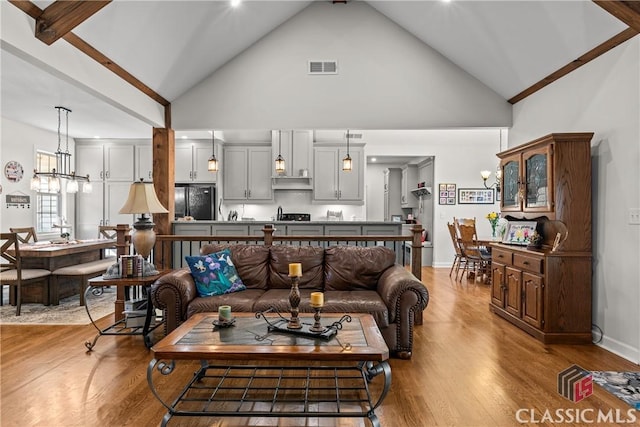1233 Staplers Bridge Rd, Nicholson, GA 30565 - living room featuring high vaulted ceiling and wood finished floors