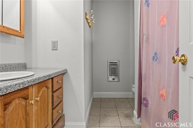 1233 Staplers Bridge Rd, Nicholson, GA 30565 - bathroom with heating unit, vanity, and tile patterned flooring