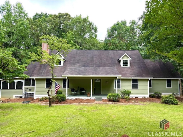 2181 Whippoorwill Rd, Bishop, GA 30621 - cape cod home featuring a front yard, a chimney, and covered porch