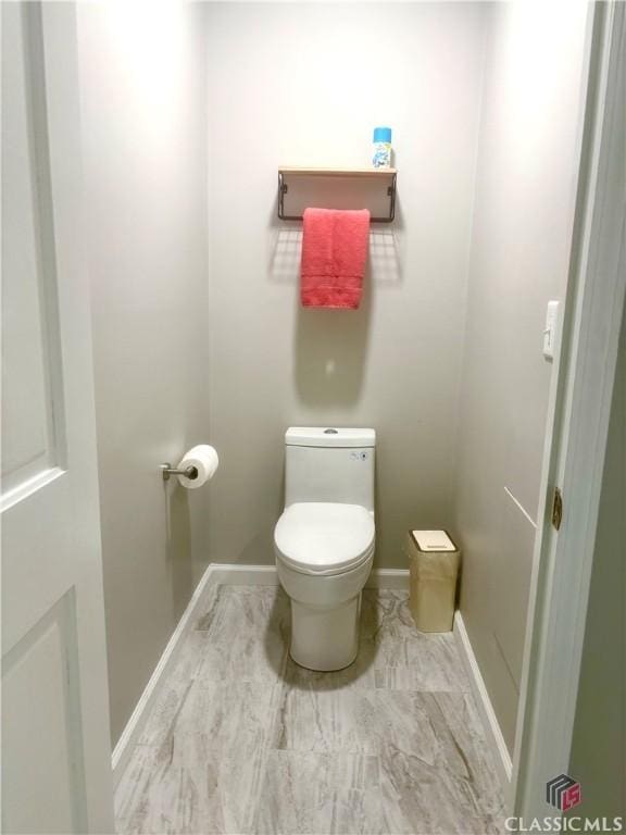 2181 Whippoorwill Rd, Bishop, GA 30621 - bathroom with toilet and baseboards
