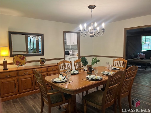 2181 Whippoorwill Rd, Bishop, GA 30621 - dining area featuring a chandelier and dark wood finished floors