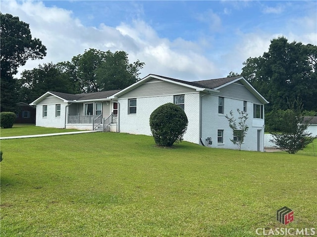 220 Swanson Dr W Unit 1, Athens, GA 30606 - view of front of house with brick siding, a front lawn, and covered porch
