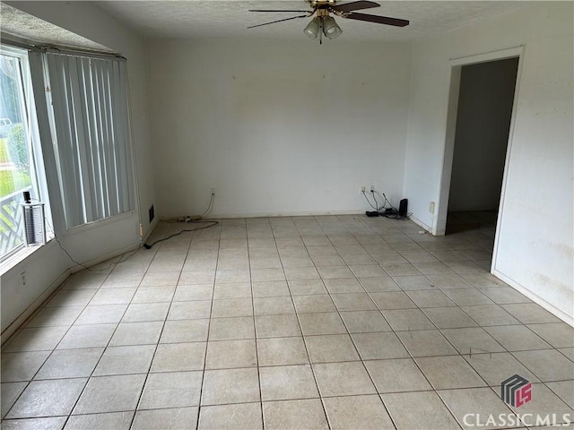 220 Swanson Dr W Unit 1, Athens, GA 30606 - empty room featuring ceiling fan, plenty of natural light, a textured ceiling, and light tile patterned floors