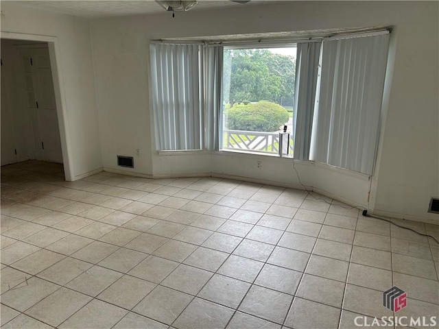 220 Swanson Dr W Unit 1, Athens, GA 30606 - empty room featuring light tile patterned floors and baseboards