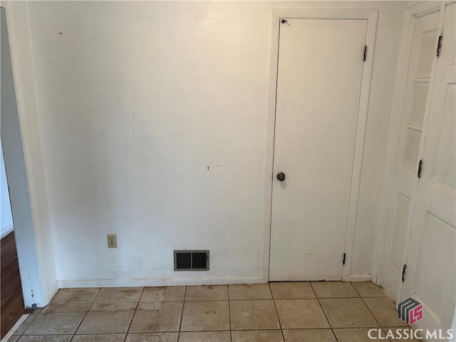 220 Swanson Dr W Unit 1, Athens, GA 30606 - empty room with light tile patterned flooring and baseboards
