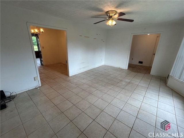 220 Swanson Dr W Unit 1, Athens, GA 30606 - spare room with light tile patterned flooring, a chandelier, ceiling fan, and a textured ceiling