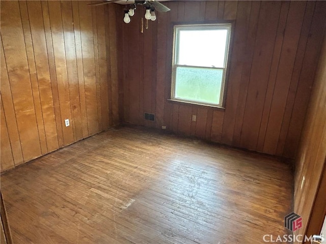 220 Swanson Dr W Unit 1, Athens, GA 30606 - empty room featuring hardwood / wood-style floors, wood walls, and ceiling fan