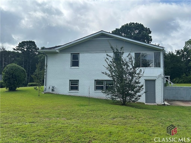 220 Swanson Dr W Unit 1, Athens, GA 30606 - view of side of home with brick siding and a lawn