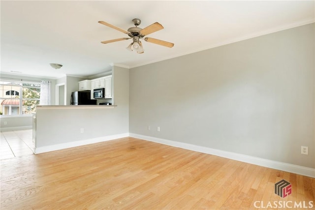 105 Whitehead Rd Unit 17, Athens, GA 30606 - unfurnished living room with ornamental molding, light wood-type flooring, and ceiling fan