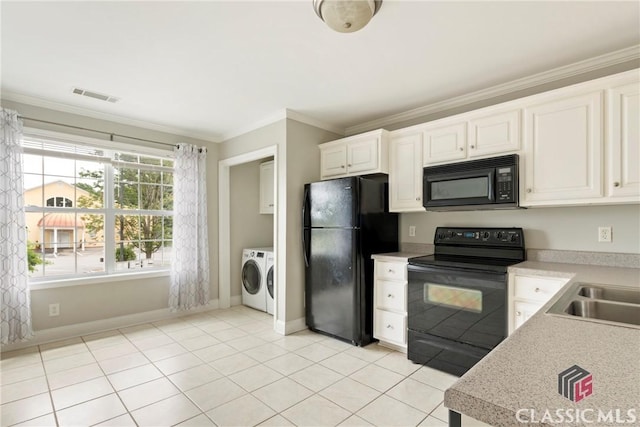 105 Whitehead Rd Unit 17, Athens, GA 30606 - kitchen with black appliances, separate washer and dryer, crown molding, light countertops, and light tile patterned floors