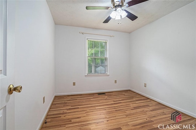 148 Hunters Crossing Rd, Athens, GA 30606 - spare room featuring light wood-type flooring, a ceiling fan, and a textured ceiling
